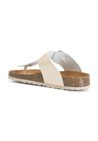 Sandal color beige chiaro e bianco con suola in sughero testurizzata. Presenta una larga fascia sulla punta e una soletta sagomata per il comfort. Profilo piatto.