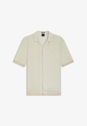 Vaaleanbeige lyhythihainen nappilistalla varustettu paita, jossa on hienovarainen kuvio, leirikaulus ja raidalliset kalvosimet sekä helma.