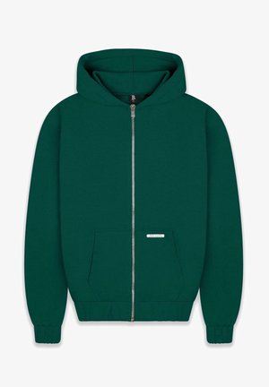 Ciemnozielona bluza z kapturem na zamek, wykonana z miękkiej tkaniny. Posiada przednią kieszeń, ściągacze na rękawach i u dołu oraz podszewkę w kapturze. Widoczna mała metka z logo.