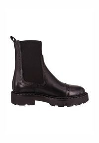 Czarny skórzany botek za kostkę z elastycznymi bokami, zaokrąglonym noskiem i subtelnymi zdobieniami brogue na cholewce. Gruba, ryflowana podeszwa dla lepszej przyczepności.