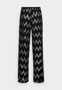 Svarta vida byxor med silverfärgad zickzackmönster och elastisk midja på enfärgad vit bakgrund.