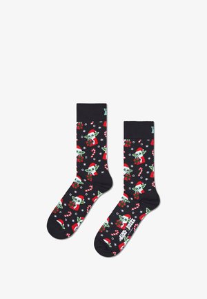 Black socks with festive green and red graphics featuring a character in a Santa hat, candy canes, and snowflakes. Cotton blend material.
