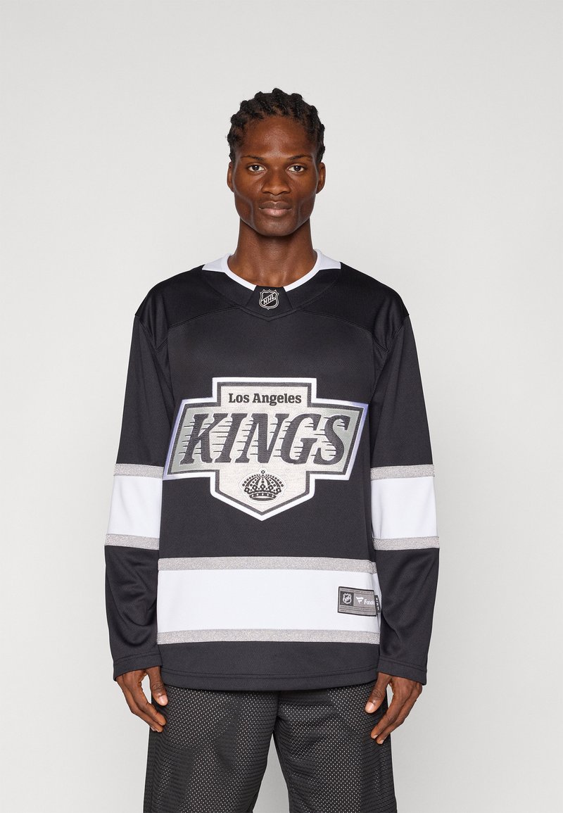 Mustam jäähoki särk "Los Angeles KINGS" logo, hõbedased aktsendid ja valged triibud varrukatel. Omab ümmargust kaelust ja NHL sildit.