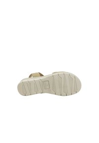 Sandal beige con cinturino regolabile, dotata di suola in gomma testurizzata con impronte distintive per una presa e stabilità migliorate.
