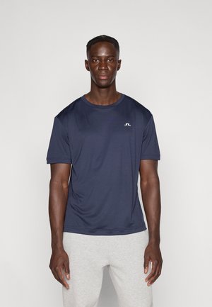 Marineblauw sportshirt gemaakt van glad, lichtgewicht materiaal, met een ronde hals en korte mouwen. Klein logo op de borst.