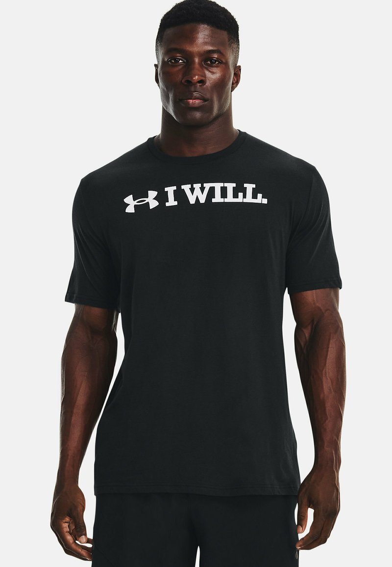 T-shirt di cotone nero con maniche corte, con la scritta bianca "I WILL." e il logo Under Armour sopra, scollatura rotonda, design essenziale.