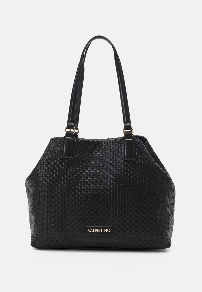 Black woven leather handbag with dual flat handles, a structured silhouette, and a gold logo accent on the front. Textured surface.