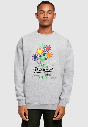 Gray sweatshirt featuring a colorful floral design and abstract hands. Includes printed text: "Picasso apoh London" and signature details.