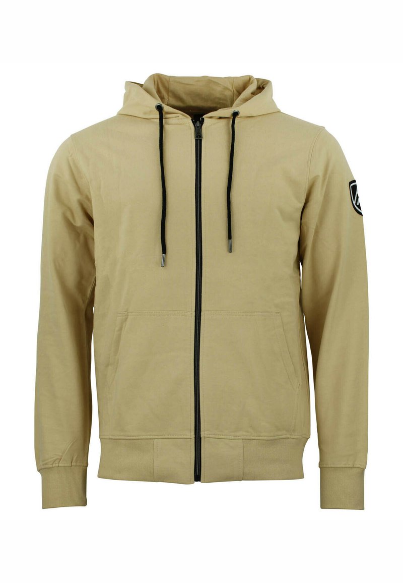 Sudadera con cremallera color beige, con capucha ajustable, cremallera negra y bolsillos laterales. Puños y dobladillo acanalados, con un parche de logo en la manga.