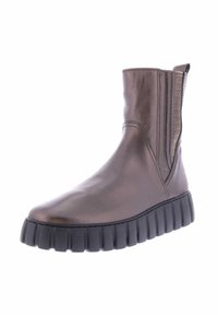 Bronze leather ankle boot with elastic side panels, round toe, and thick black rubber sole featuring ribbed detailing.