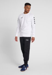 Hummel PANT - Trainingsbroek - black