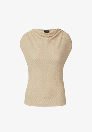 Haut beige texturé avec un col drapé, des manches courtes et une silhouette ajustée. Le matériau présente un tissage à motifs subtils.