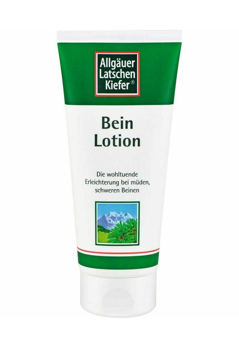 Weißer Tubus mit grünen Akzenten, beschriftet mit "Bein Lotion." Enthält eine Illustration von Bergen und Grünflächen. Der Text auf Deutsch beschreibt die Anwendung.