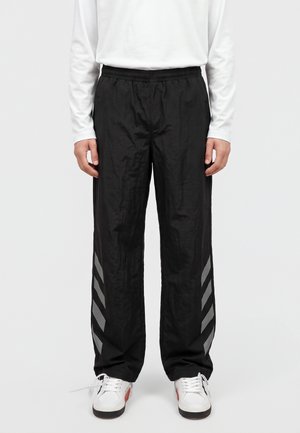 L/AB c/o Off-White, REFLECTIVE DIAG PANTS - Долнище на анцуг - black