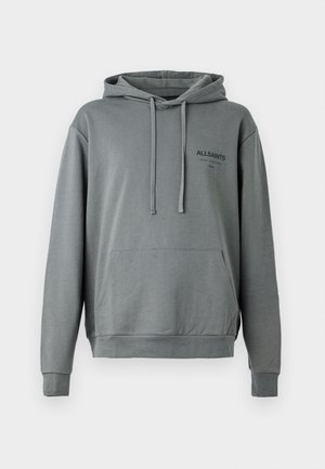 Grey cotton hoodie with a front pocket, drawstring adjustable hood, and black logo on the chest. Soft texture and relaxed fit.