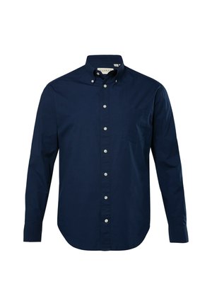Camicia blu navy a maniche lunghe con colletto appuntito, taschino frontale e bottoni bianchi su un tessuto liscio e strutturato.