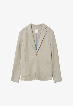 Blazer beige en tissu texturé ; doté d'une fermeture à un bouton, de deux poches avant et d'un col cranté. Intérieur bleu en contraste.