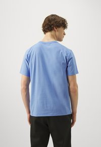 Nike Performance HYVERSE - T-shirt de sport - royal pulse/black