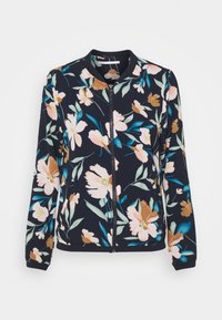 Veste bomber florale avec un fond bleu marine, de grandes fleurs roses et brunes, un col côtelé, et une fermeture éclair frontale avec des poignets élastiques.
