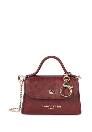 Maroon leather handbag with a structured design, gold hardware, a short handle, and a detachable chain strap. Features a logo accent.