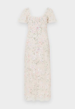 Φλοράλ μίντι φόρεμα σε ανοιχτό μπεζ με κοντά φουσκωτά μανίκια. Διαθέτει κεντητά ροζ, μπλε και πράσινα λουλουδένια μοτίβα με λεία υφή.