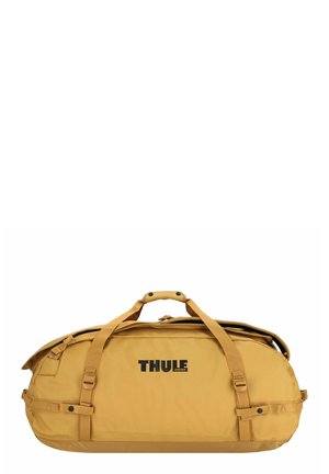 Thule sporttas in mosterdgeel, gemaakt van duurzaam materiaal. Kenmerkt dubbele handvatten, verstelbare schouderbanden en een grote hoofdcompartiment. Logo zichtbaar.