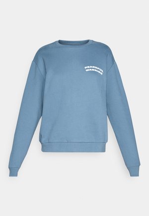 Blue sweatshirt made of soft fabric, featuring a crew neck, long sleeves, and the text "PEACEFUL WARRIOR" in white on the left chest.