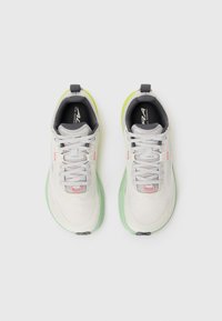 White and gray athletic shoes with green soles and pink accents, displayed side by side on a plain white background.