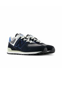 Black and navy suede athletic shoes with a white midsole, light gray accents, prominent blue logo, and black rubber outsole.