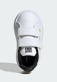 White children's sneaker made of synthetic material with two Velcro straps, black interior, and “Safety World” branding on the tongue.