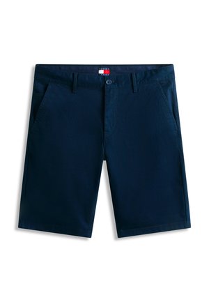 Tumesinised vabaajaklõpsuga püksid esitaskutega, vööaasadega, nööpkinnitusega ja Tommy Jeans'i logomärgisega vöökohal.