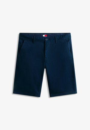 Tumesinised vabaajaklõpsuga püksid esitaskutega, vööaasadega, nööpkinnitusega ja Tommy Jeans'i logomärgisega vöökohal.