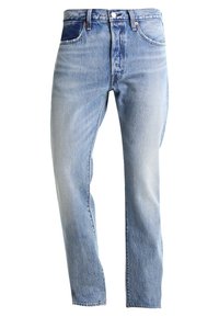 Light blue denim jeans with a high waist, straight leg design, faded finish, and two front pockets. Copper hardware accents feature on the waistband.