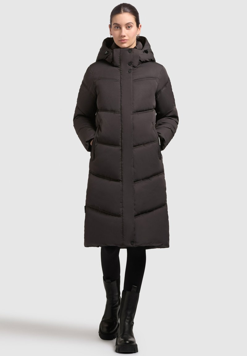 Black, long puffer coat with a hood, featuring a quilted design, front buttons, and side pockets; made from a smooth, insulated material.