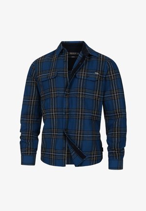 Sininen ja musta ruudullinen flanellipaita, jossa on napitettavat kaulukset, kaksi rintataskua ja pehmeä rakenne. Korostaa valkoisia ompeleita.