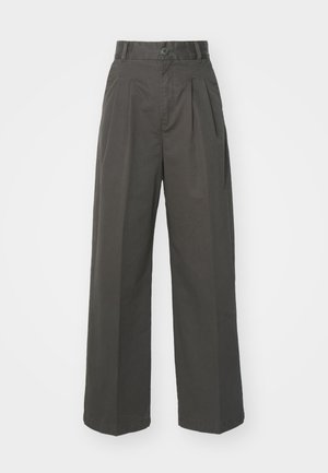 Højtaljede, antracitgrå bukser lavet af bomuld. Har læg, en enkelt knaplukning og brede, lige ben. Glat tekstur.