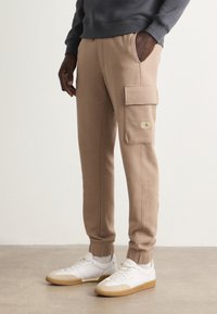Calvin Klein Jeans - Tracksuit bottoms - taupe gray Thumbnail Image 1