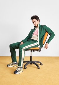 Ellesse BERLUSONI TRACK TOP - Træningsjakke - dark green