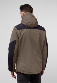 Hooded jack in bruin en marineblauw met een gladde textuur. Beschikt over contrasterende panelen op de schouders en mouwen, met ritsmanchetten.