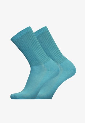 Helle blaue Baumwollsocken mit geripptem Bündchen, knöchellang und nahtlosem Zehendesign. Sanfte Textur und flexible Passform.