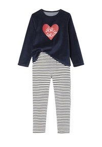 Navy velvet pajama top with red heart graphic, paired with cream and navy striped pants, featuring an elastic waistband and long sleeves.