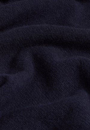 Mörk marinblå ulltyg med en mjuk, texturerad yta, som visar en slät, något fluffig look och subtila nyansvariationer.