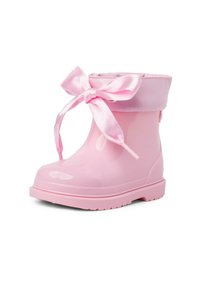 Botte de pluie en caoutchouc rose avec une finition brillante, bout arrondi et détail en nœud en satin sur le haut. Dotée d'une semelle texturée pour une meilleure adhérence.