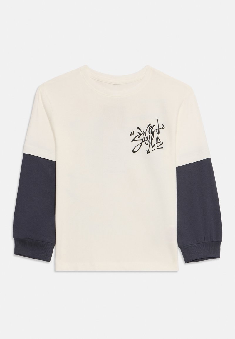 name it Longsleeve crème