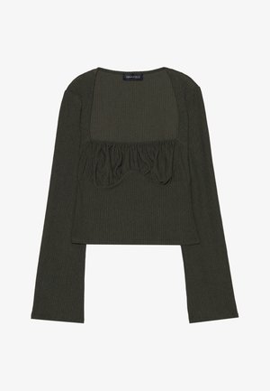 Zaļa ribota garām piedurknēm tops ar kvadrātveida kakla izgriezumu, piedāvā savelkamas detaļas pie krūtīm un īsu garumu. Redzama zīmola etiķete.