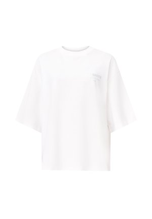 Biała, oversize'owa koszulka z miękkiej bawełny, z okrągłym dekoltem i krótkimi rękawami. Subtelny detal z logo z przodu.