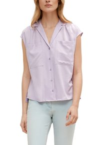 Lavender short-sleeve blouse with a button-up front, two chest pockets, a collar, and a loose fit, made from a smooth fabric.