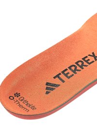 Orange Terrex branded shoe insole with Ortholite O-Therm text on a white background.