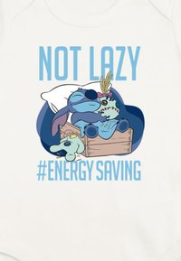 White onesie featuring a graphic design of cartoon characters sleeping in a box, with the text "NOT LAZY #ENERGY SAVING" in blue.