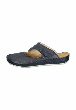 Dark navy leather slip-on shoe with a flexible sole, cut-out design, and a Velcro strap for secure fit. Textured upper with stitching details.